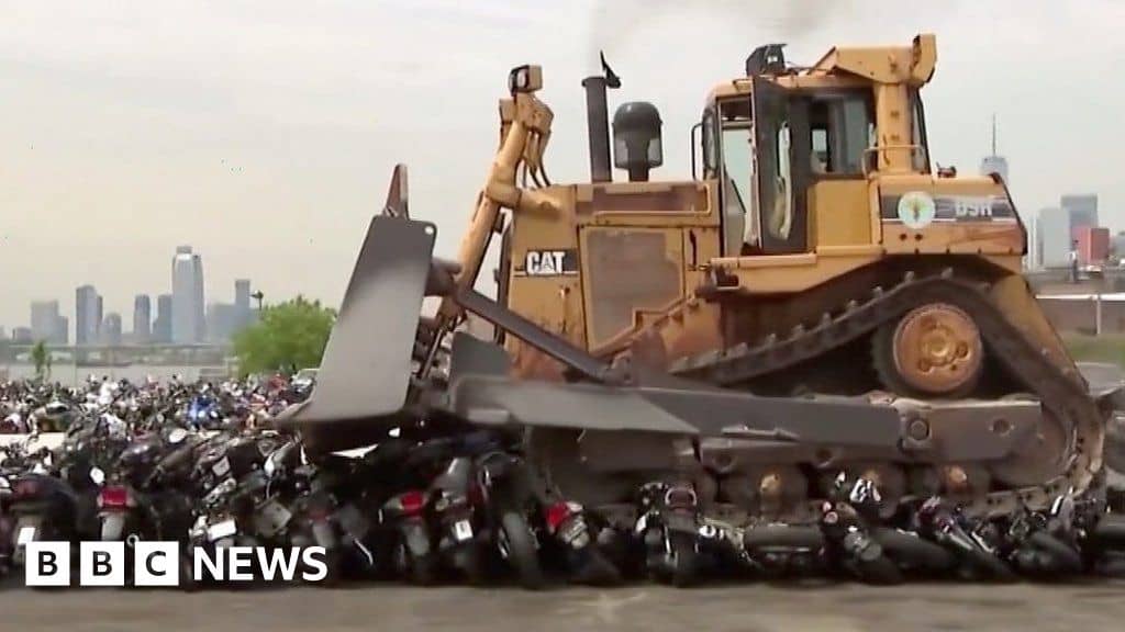 Bulldozer crushes 100 seized vehicles in New York